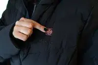 A hand touching the logo on the ORORO SOHO Women