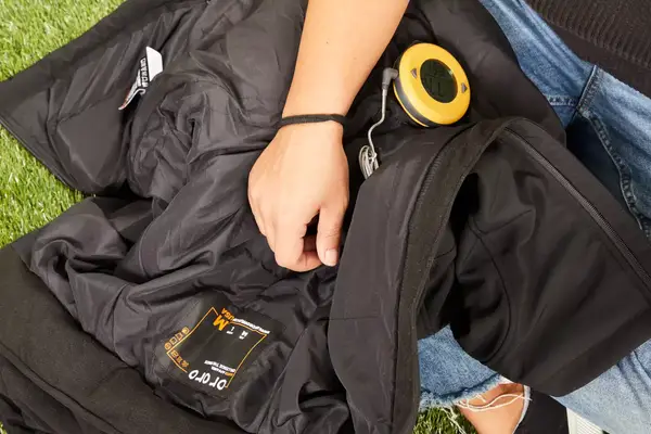 A close-up of a light up button on the Venture Heat Men