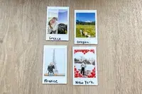 Four Polaroid photos labeled as Greece Oregon France and New York depicting respective locations and moments