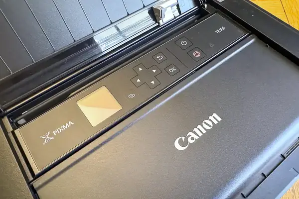 Closeup of a Canon Pixma TR160 printer with control buttons and a small display
