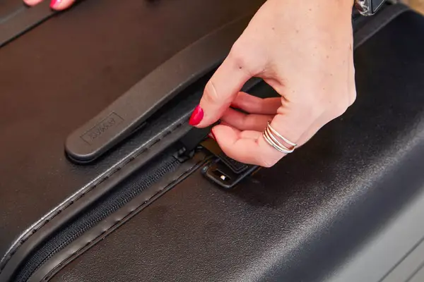 Hand zipping the Away The Trunk