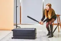 Person hitting the Away The Trunk with a baseball bat