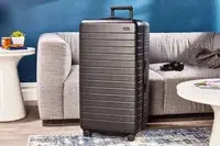 Away The Trunk displayed in front of a sofa