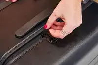 Hand zipping the Away The Trunk