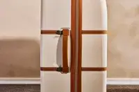 A close up of the side handle on the Delsey Paris Chatelet Air 2.0 28 Inch Large Checked Spinner