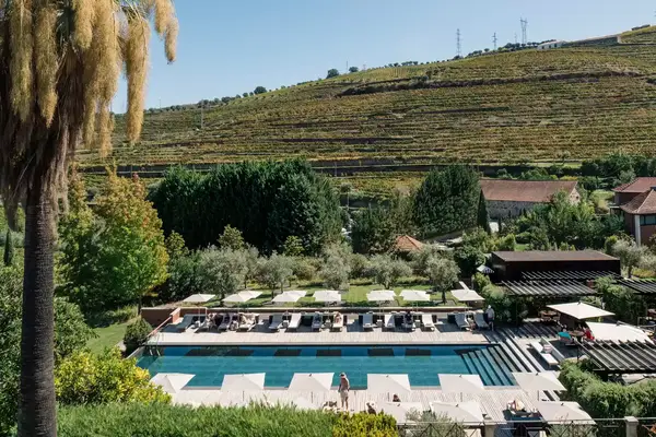 The pool at the Six Senses Douro Valley resort in Portugal, with vineyards in the background