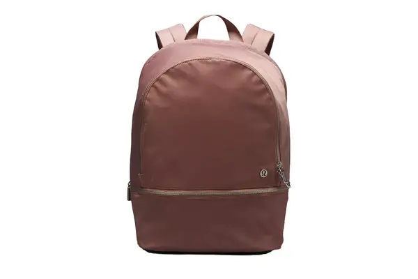 A person walks through grass while wearing the Mack Weldon Ace Sweatpant