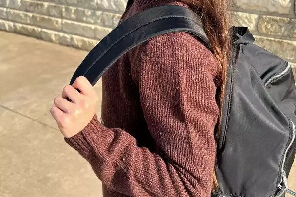 A student wearing the lululemon City Adventurer Pack