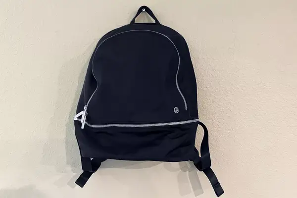lululemon City Adventurer Backpack hanging on a hook on a wall