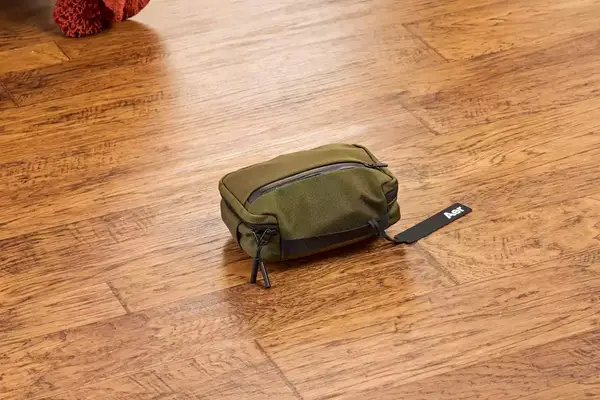 The Aer Travel Kit 2 on a wooden floor