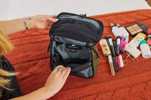 A person opens the Aer Travel Kit 2