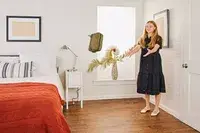 A person throws the Aer Travel Kit 2 across a room