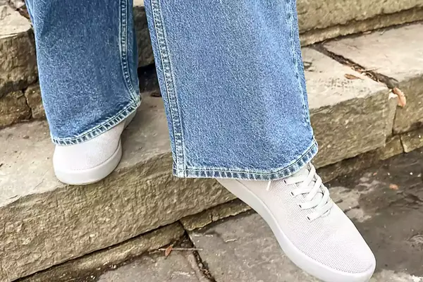 Person walking down stairs wearing Atoms Model 000