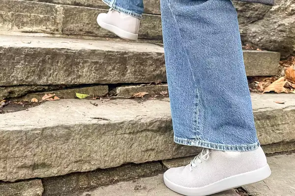 Person walking up stairs wearing Atoms Model 000