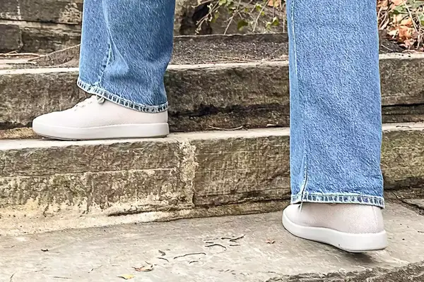 Person walking up stairs wearing Atoms Model 000