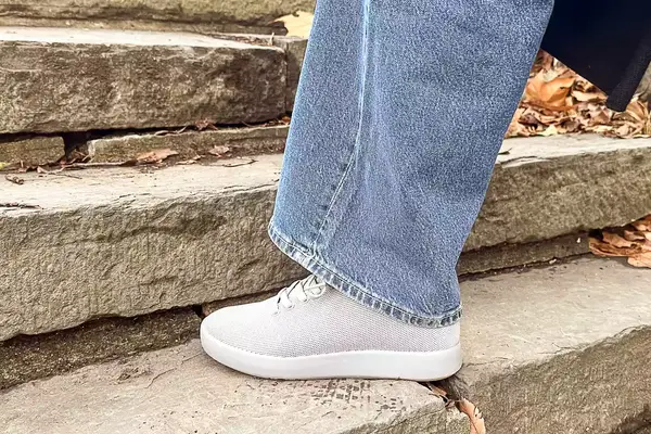 Person walking up stairs wearing Atoms Model 000