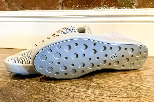 Pair of Atoms Model 000 on a wooden floor showing their soles