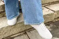 Person walking down stairs wearing Atoms Model 000