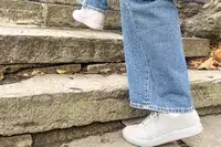 Person walking up stairs wearing Atoms Model 000