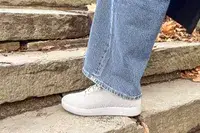 Person walking up stairs wearing Atoms Model 000