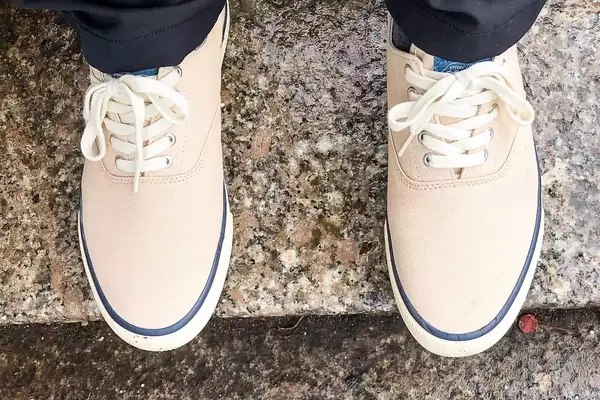person wearing Sperry Unisex Classic CVO Sneakers on a marble floor
