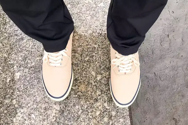 person wearing Sperry Unisex Classic CVO Sneakers on a marble floor