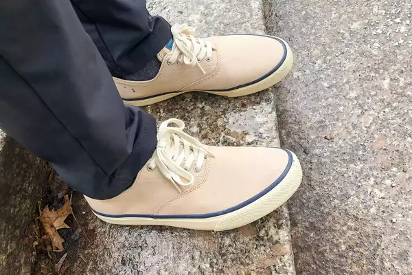 person wearing Sperry Unisex Classic CVO Sneakers on a marble floor