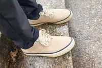 person wearing Sperry Unisex Classic CVO Sneakers on a marble floor