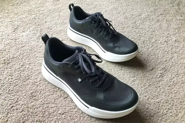 Two AHNU Sequence 1 sneakers posed on carpet