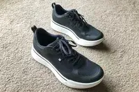 Two AHNU Sequence 1 sneakers posed on carpet