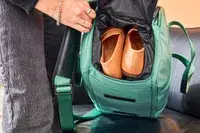 Hand with shoe pocket of Arlo Skye The Weekender