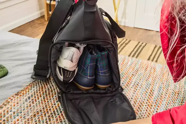 Shoes seen inside the Rains Large Texel Kit Bag