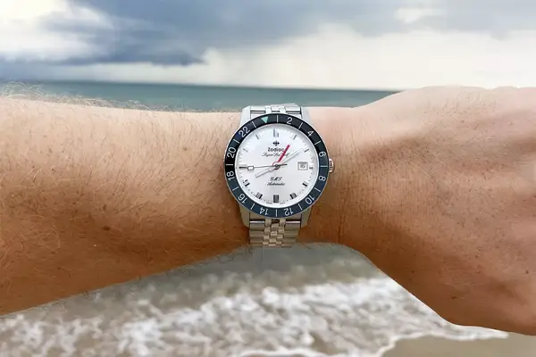 zodiac super sea wolf gmt automatic watch at the ocean with stormy sky