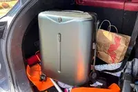The MiaMily Carry-On packed into a trunk of a car