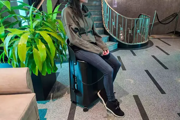 A person sitting on the MiaMily Check In