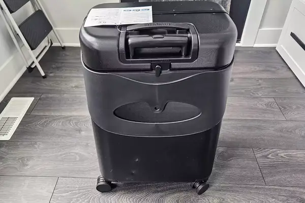 The MiaMily Check In on a wooden floor