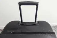 A close-up of the handle of the MiaMily Check In