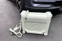 The ​​Stokke JetKids BedBox in front of a car