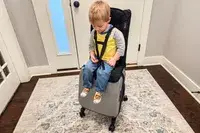 A child sitting on the Mountain Buggy Skyrider Luxury