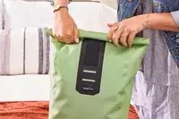 A person rolls the top of the Ortlieb Velocity PS Pack 17L