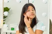 Applying sunscreen to face