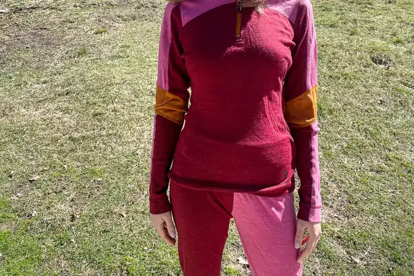 Front side of person wearing Smartwool Classic Thermal Merino Base Layer 1/4 Zip.