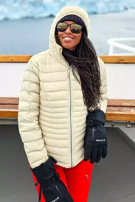 A person wearing winter clothes, including a Cotopaxi Women