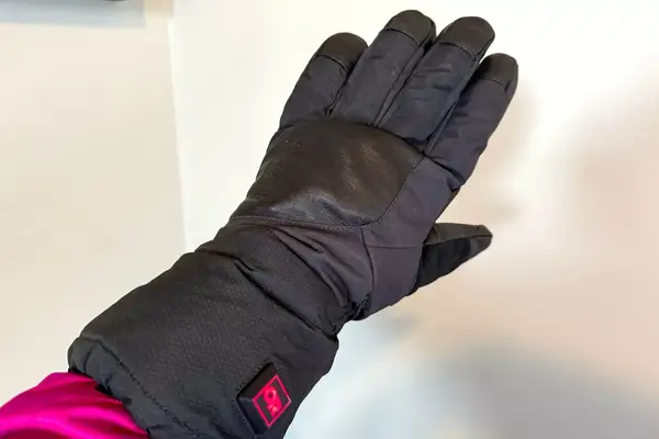A person wears the Outdoor Research Prevail Heated GORE-TEX Gloves while powered on