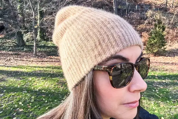 Close up view of a person wearing the White + Warren Cashmere Beanie