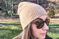 Close up view of a person wearing the White + Warren Cashmere Beanie