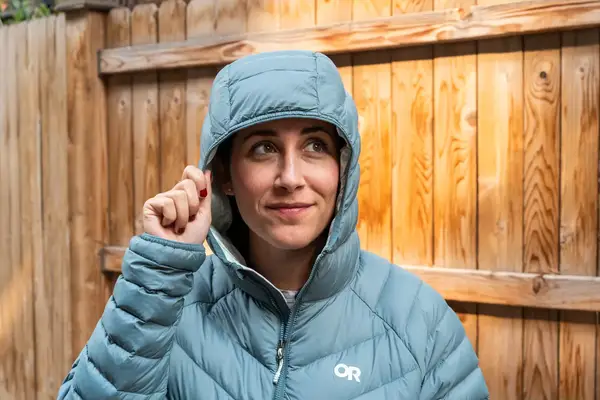 A person touching the hood of the Outdoor Research Women