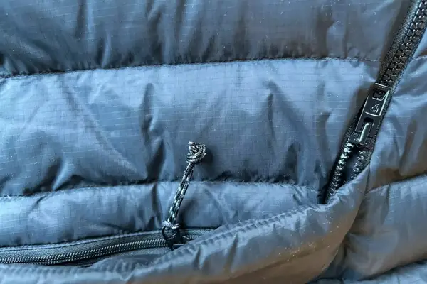 A close-up of the zippers on the Fjallraven Expedition Pack Down Anorak