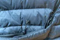 A close-up of the zippers on the Fjallraven Expedition Pack Down Anorak