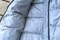 The inside of the Quince Responsible Down Long Puffer Jacket